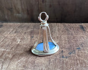 woman leaning on an anchor wax seal fob - antique wax seal