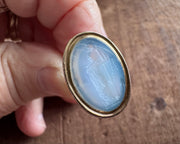 woman leaning on an anchor wax seal fob - antique wax seal