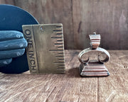 a little bird resting on an anchor leaning against a rock - antique fob wax seal