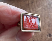 a little bird resting on an anchor leaning against a rock - antique fob wax seal