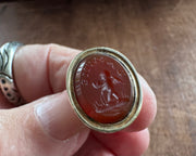 a winged cherub delivering a heart fob seal - L'AMITIE - antique wax seal