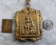 large Victorian lovers swivel locket with tintype photo - antique jewelry