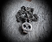 skull necklace pendant - with a tiny gold tooth - memento mori jewelry