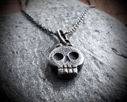 skull necklace pendant - with a tiny gold tooth - memento mori jewelry