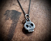 skull necklace pendant - with a tiny gold tooth - memento mori jewelry