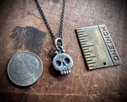 skull necklace pendant - with a tiny gold tooth - memento mori jewelry