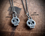 skull necklace pendant - with a tiny gold tooth - memento mori jewelry