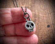 skull necklace pendant - with a tiny gold tooth - memento mori jewelry