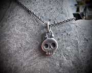 skull necklace pendant - with a tiny gold tooth - memento mori jewelry