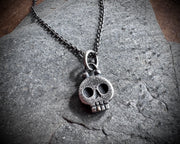 skull necklace pendant - with a tiny gold tooth - memento mori jewelry