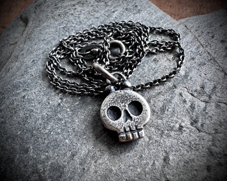 skull necklace pendant - with a tiny gold tooth - memento mori jewelry