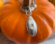 pumpkin seed pendant