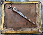 bronze coffin nail pendant