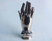 small hand sculpture