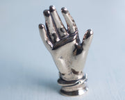 small bronze hand