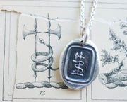 snake and axe wax seal necklace
