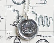 serpent in the grass wax seal necklace