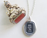 serpent and axe wax seal necklace