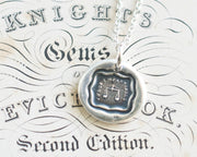 scales of justice wax seal necklace