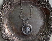 skull and ouroboros necklace