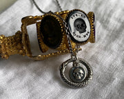 skull and ouroboros pendant