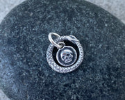 skull and ouroboros charm 