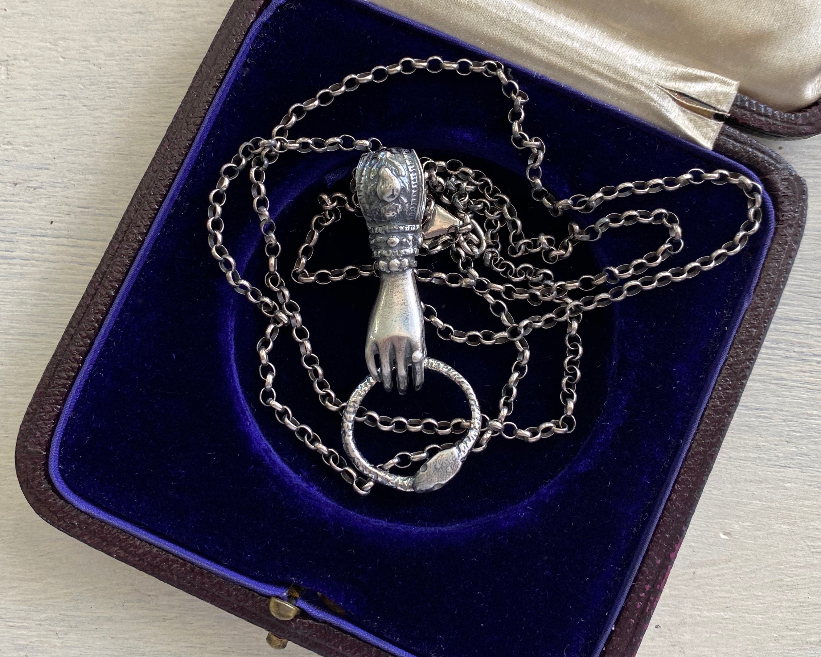 Victorian hand holding ouroboros necklace pendant - figural right