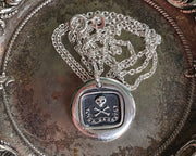 skull and bones wax seal pendant