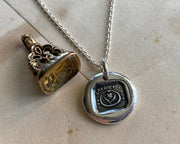 ouroboros and flower necklace