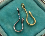 silver and gold serpent hooks
