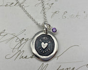 birthstone charm on the bleeding heart wax seal necklace