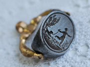 child running with a dog wax seal necklace