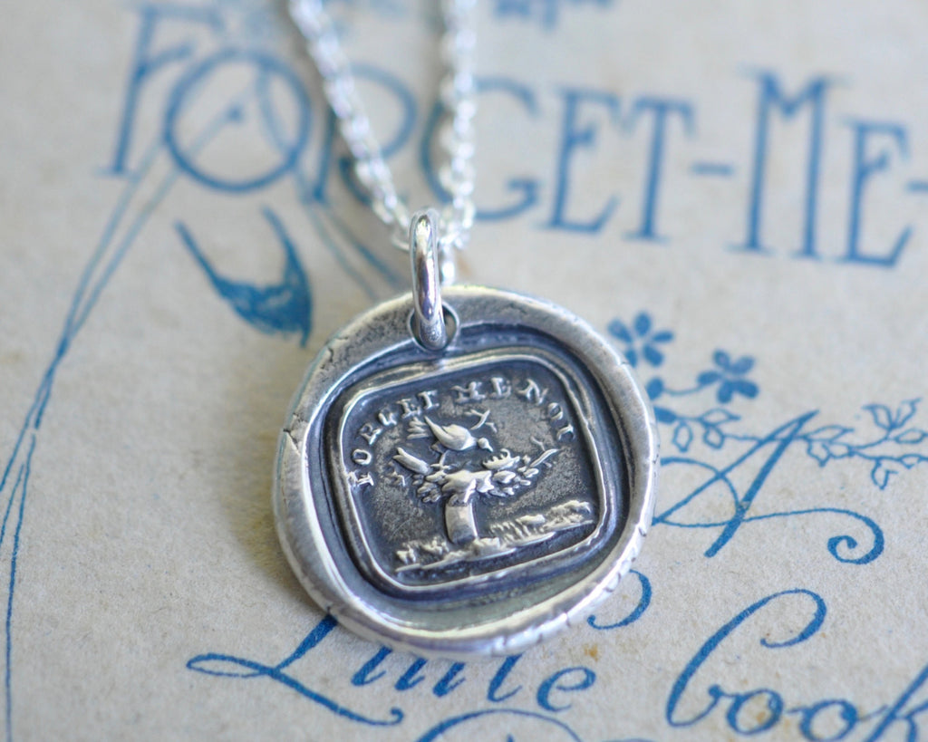 bird with empty nest wax seal necklace