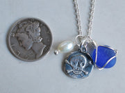 skull and crossbones wax seal, sea glass, and pearl charm necklace