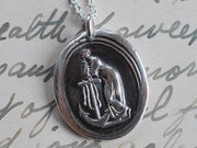 woman leaning on anchor wax seal pendant
