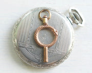 antique ouroboros watch key